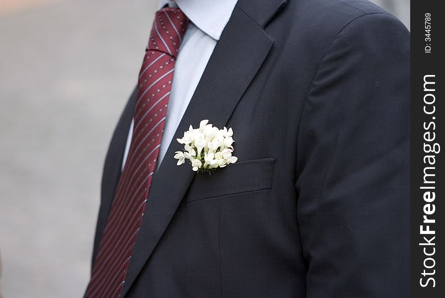Flower on jacket during a wedding. Flower on jacket during a wedding