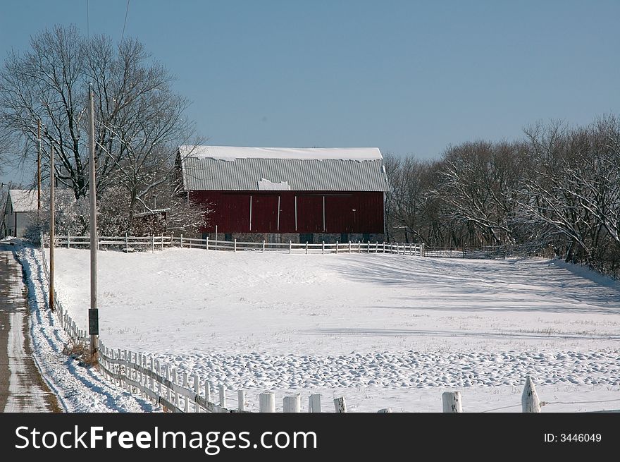 Midwest winter pasture barn scene.