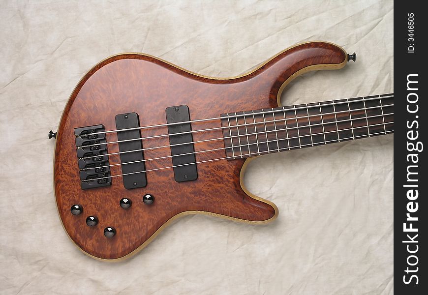 Wood Bass Guitar with body, neck and strings. Wood Bass Guitar with body, neck and strings