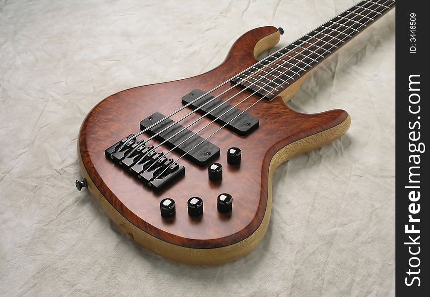 Wood Bass Guitar with body, neck and strings. Wood Bass Guitar with body, neck and strings