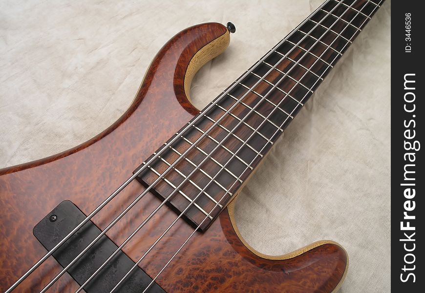 Wood Bass Guitar with body, neck and strings. Wood Bass Guitar with body, neck and strings