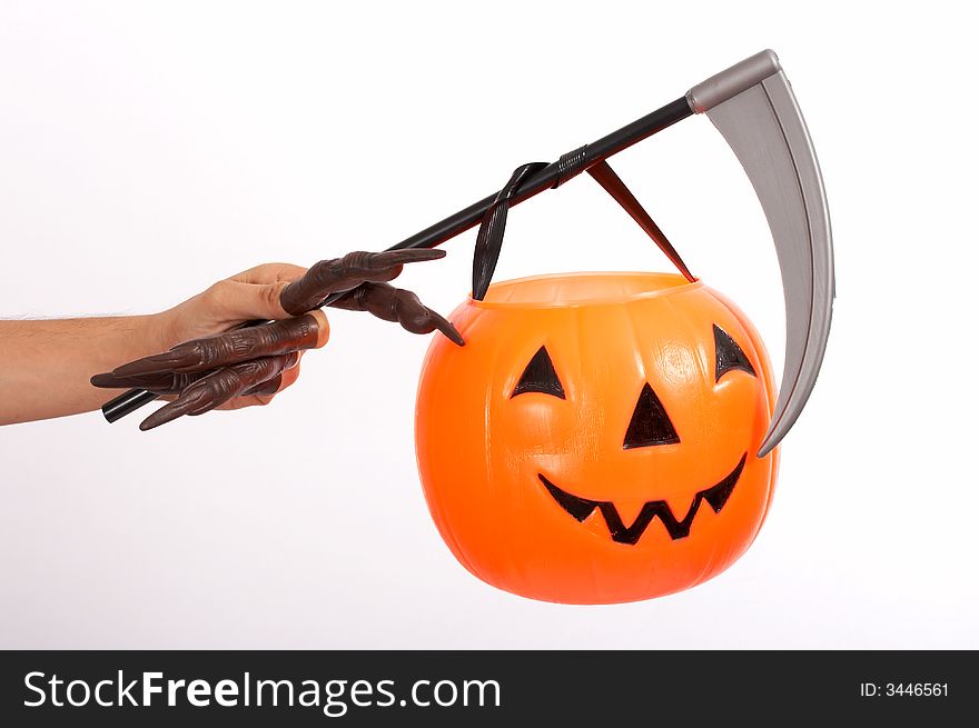 A scythe and a pumkin over a white background. A scythe and a pumkin over a white background