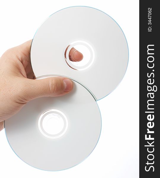 Two compact disks over a white background