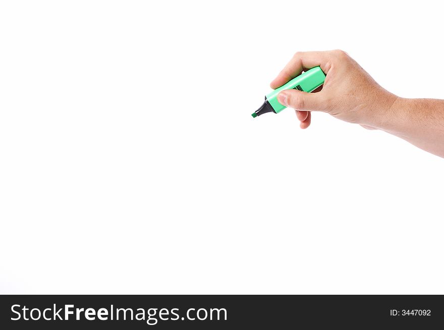 A hand holding a green marker over a white background