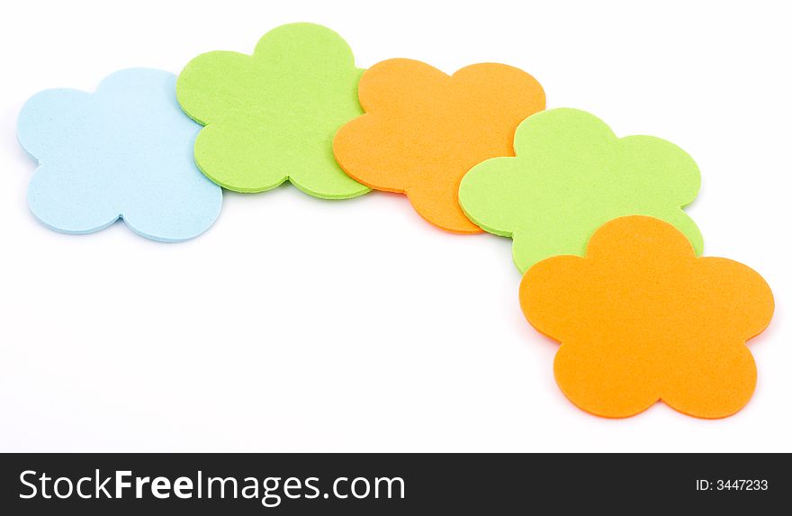 Colorful foam stickers over a white background
