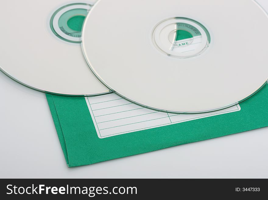 Compact disks over a white background