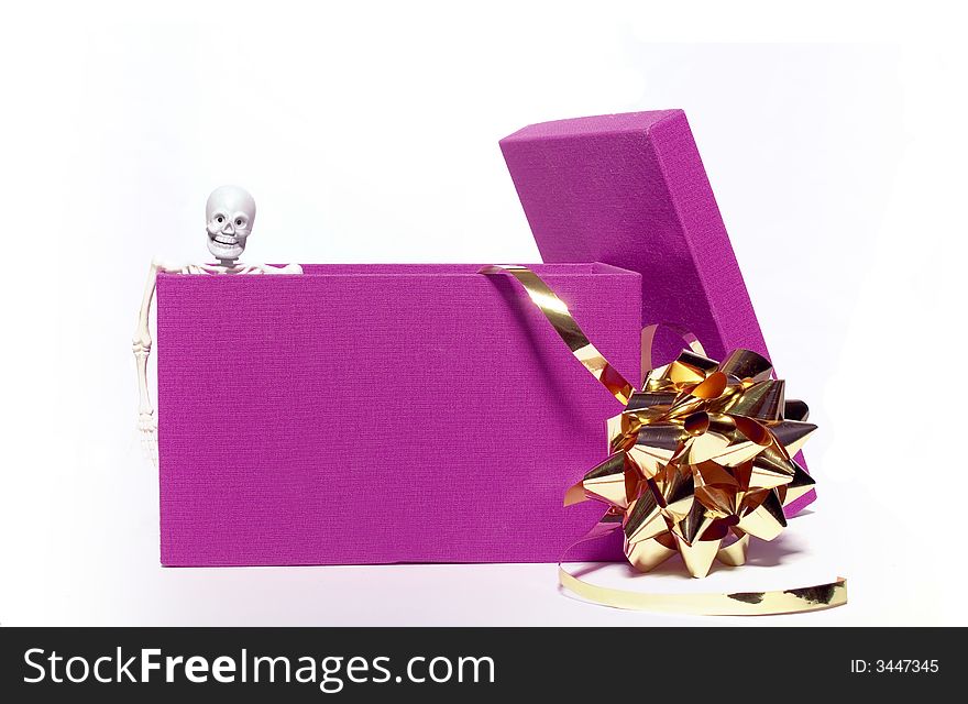 Skeleton peeking out of a purple gift box. Skeleton peeking out of a purple gift box