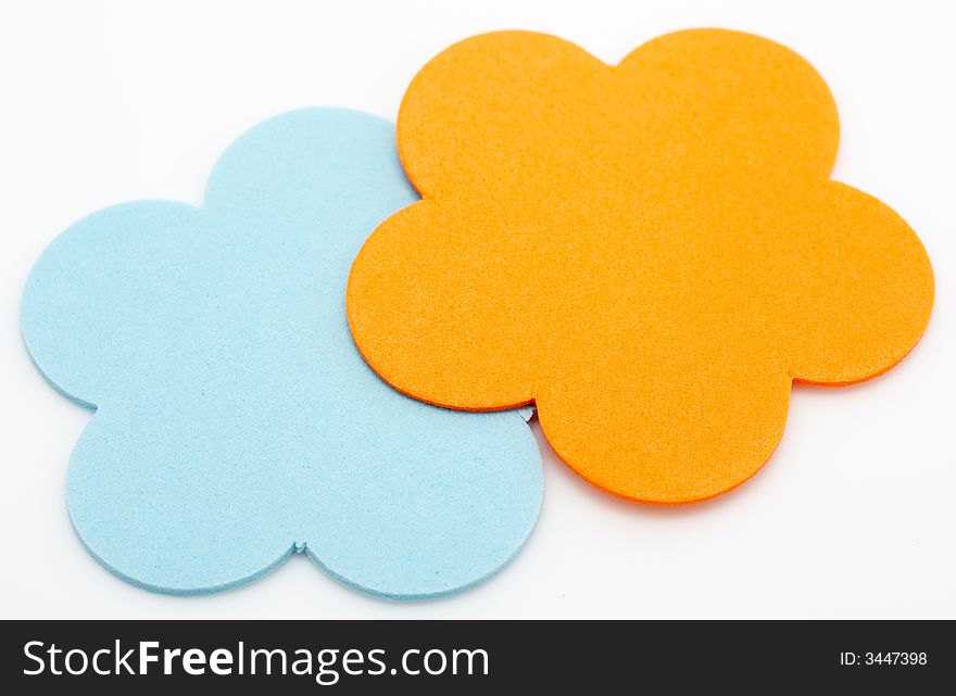 Colorful foam stickers over a white background