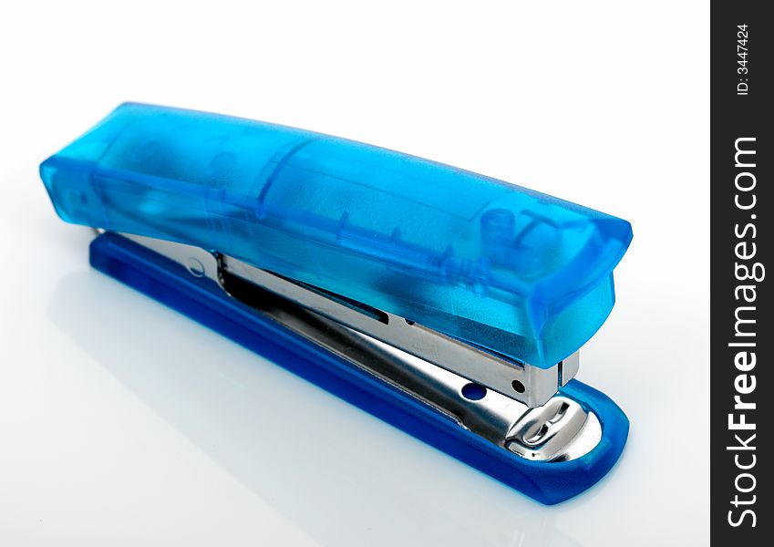 A blue stapler over a white background