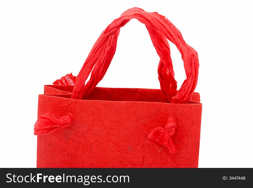 A red shopping bag over a white background