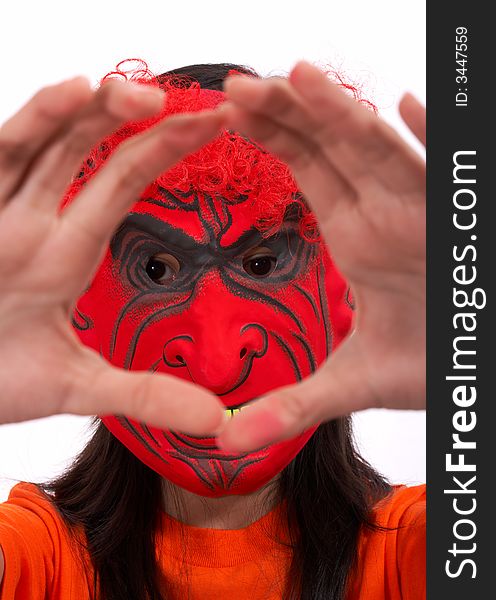 A girl wearing a scary mask over a white background
