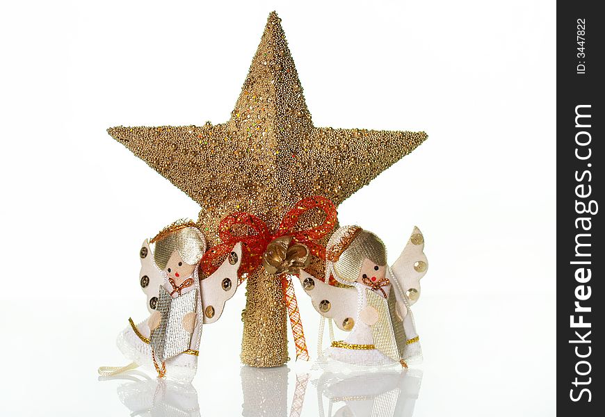 Christmas decoration; two angels and a golden star. Christmas decoration; two angels and a golden star