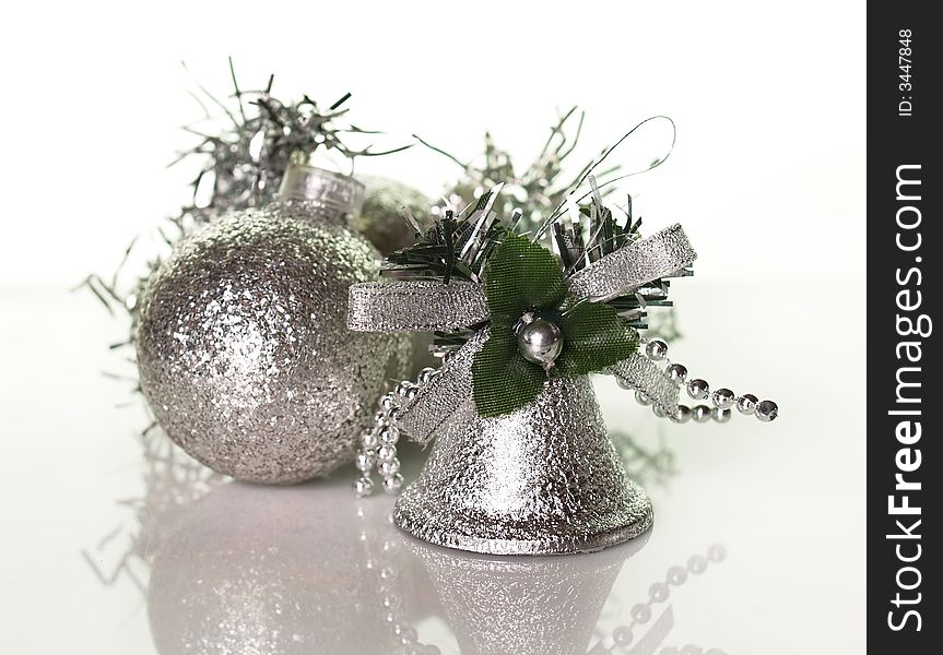 Handbell and silver Christmas balls. Handbell and silver Christmas balls