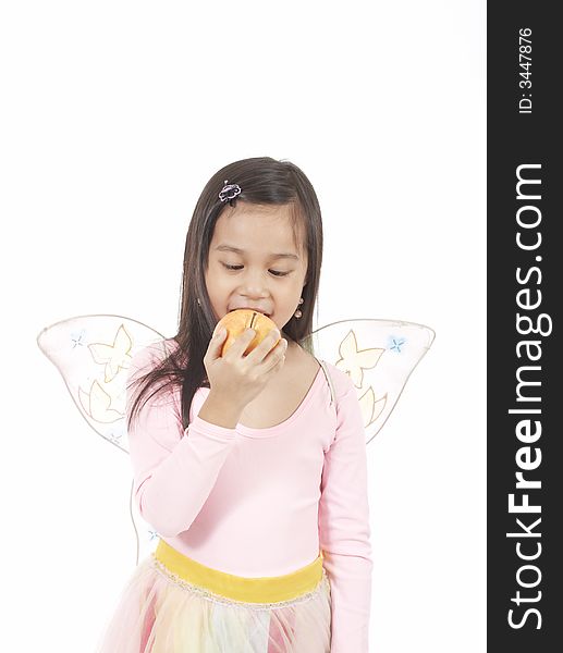 A girl wearing a fairy costume over a white background