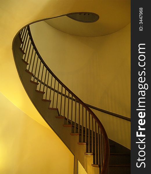 A curved staircase seems to flow upward. A curved staircase seems to flow upward.