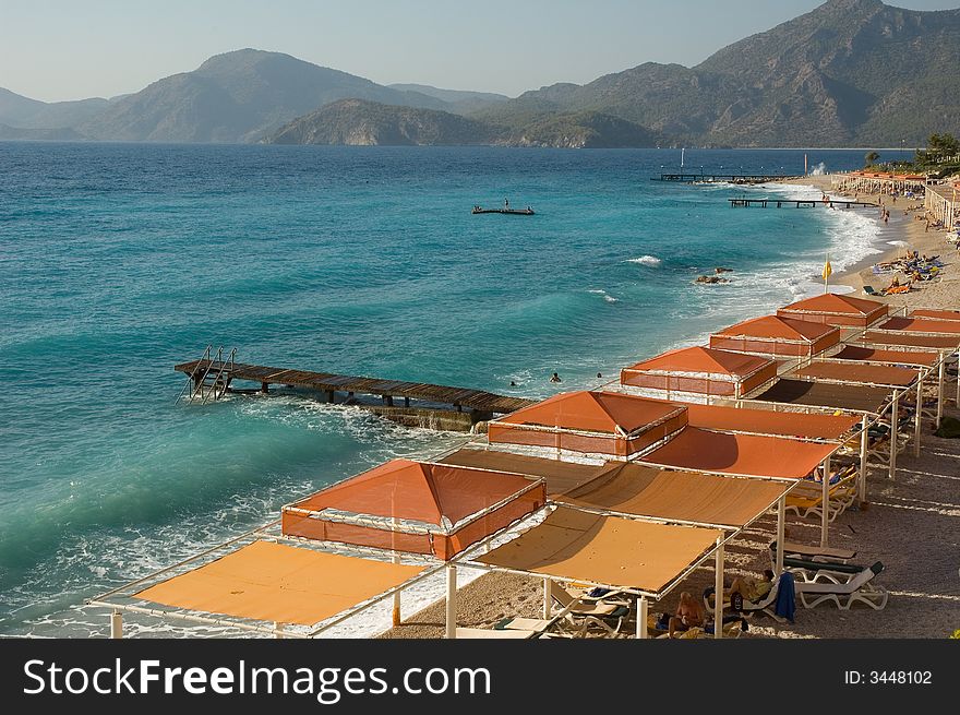 View on the nice pebble beach on the coast of the azure Mediterranian sea