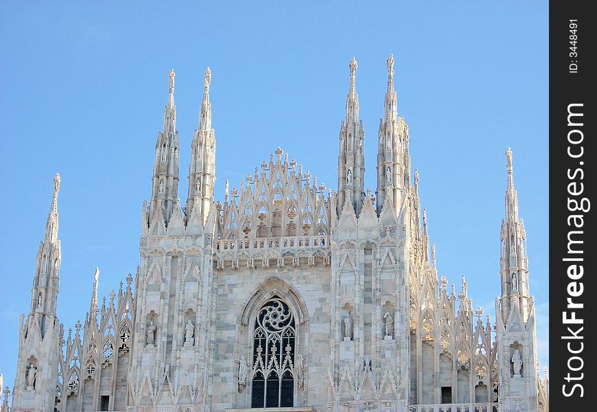 The front of the dome in Milan under a clear blu sky. it's magnificent. The front of the dome in Milan under a clear blu sky. it's magnificent.