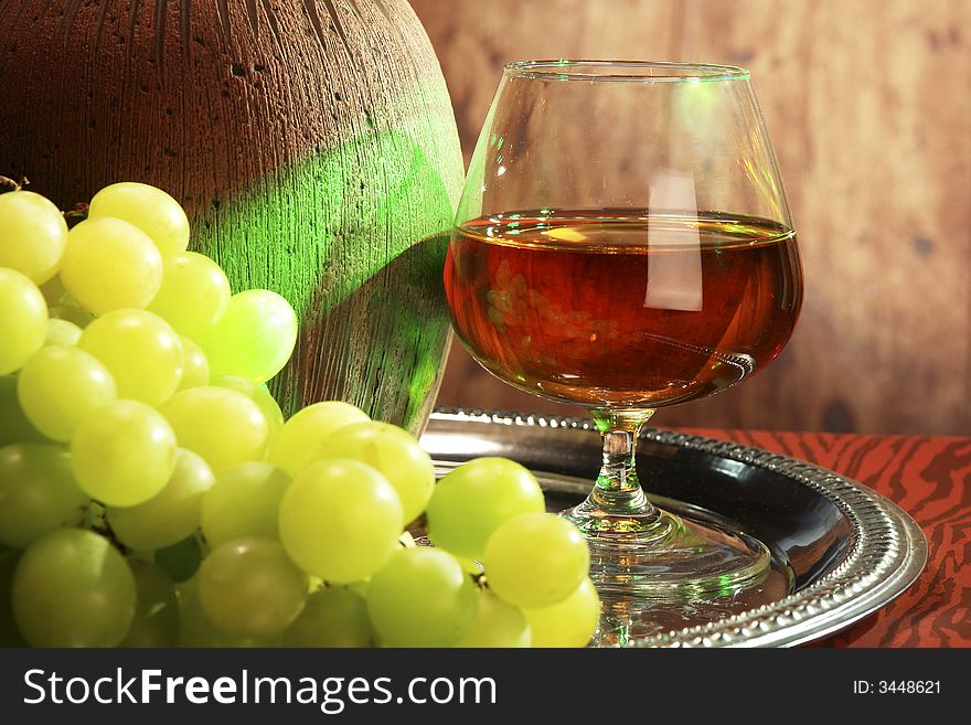 Glass of juice with grapes,