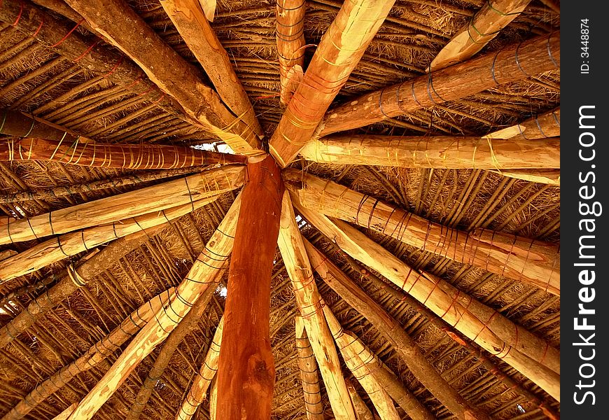 A reverse side of rooftop made up of Bamboo trunks of an Indian hut. A reverse side of rooftop made up of Bamboo trunks of an Indian hut.