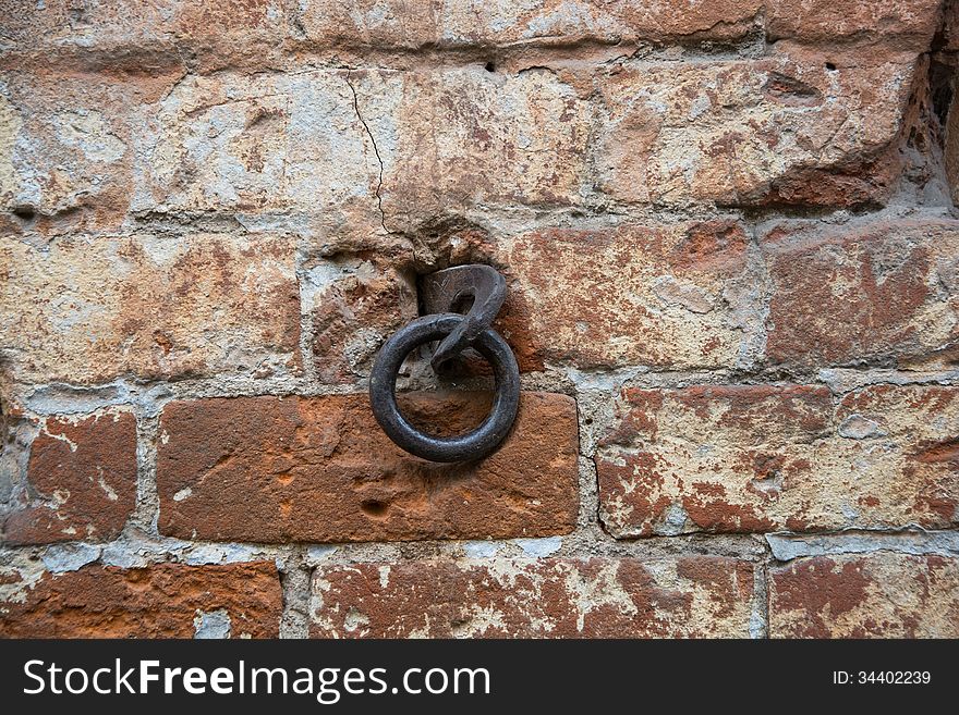 Metal ring in the old wall of red bricks. Metal ring in the old wall of red bricks.