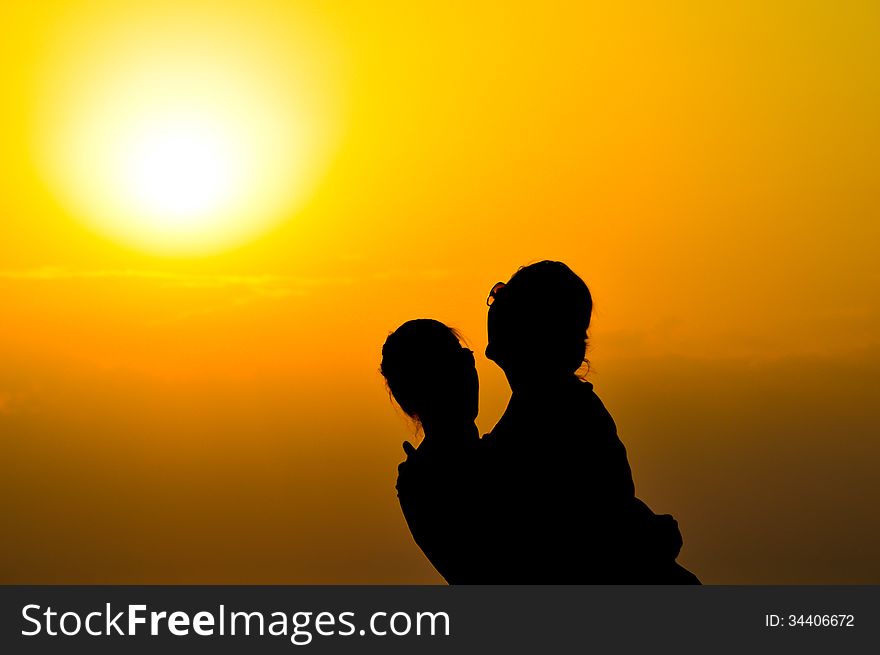 A great shot in sunset of a beautiful couple. A great shot in sunset of a beautiful couple