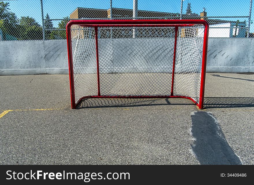 Hockey goal in the sun outside on a nice day