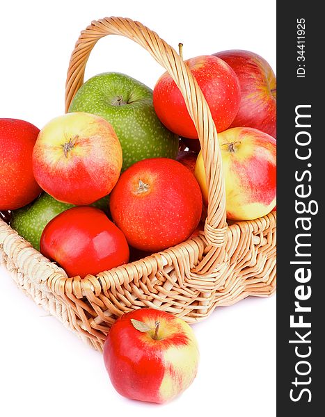Arrangement of Red and Green Apples in Wicker Basket isolated on white background. Arrangement of Red and Green Apples in Wicker Basket isolated on white background