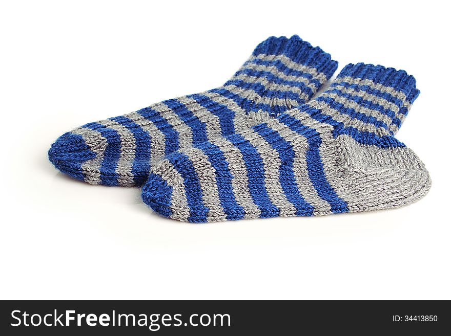 Two wool knitted socks isolated on white. Two wool knitted socks isolated on white