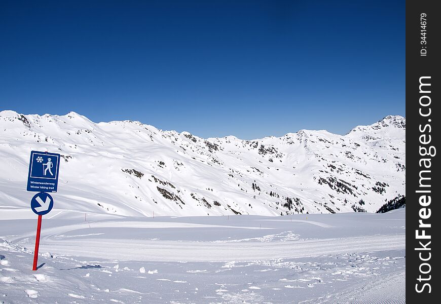 Winter hiking trail in the alps