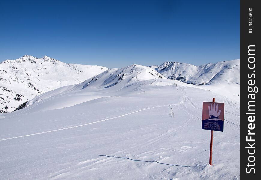 Sign in the alps wich says danger of avalanches