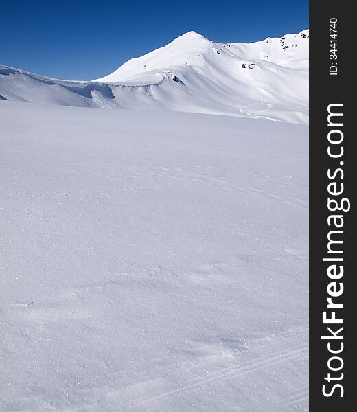 Winter landscape background high in the alps