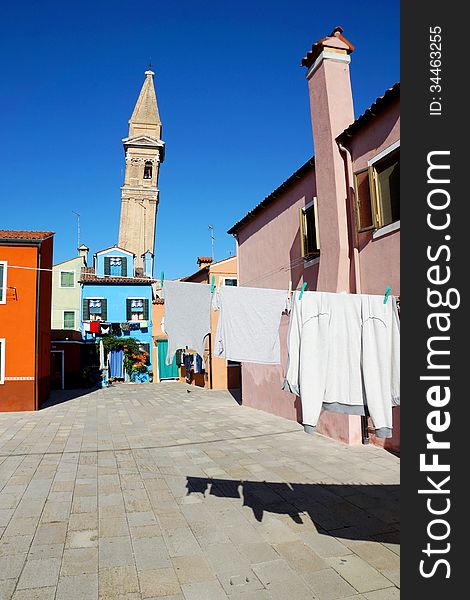 Drying clothes on a background of multi-colored facades of the i