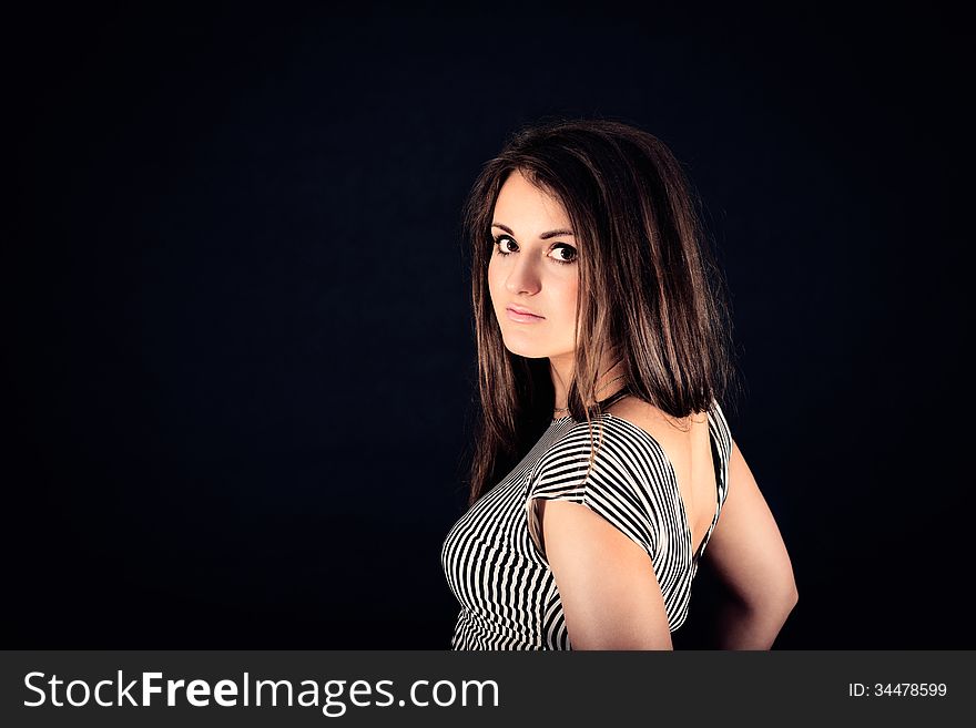 Portrait of young nice sensual girl in studio on black background. Portrait of young nice sensual girl in studio on black background