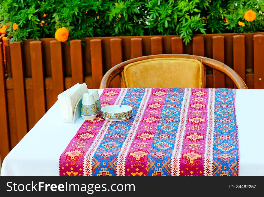 A table covered with a cloth with oriental patterns