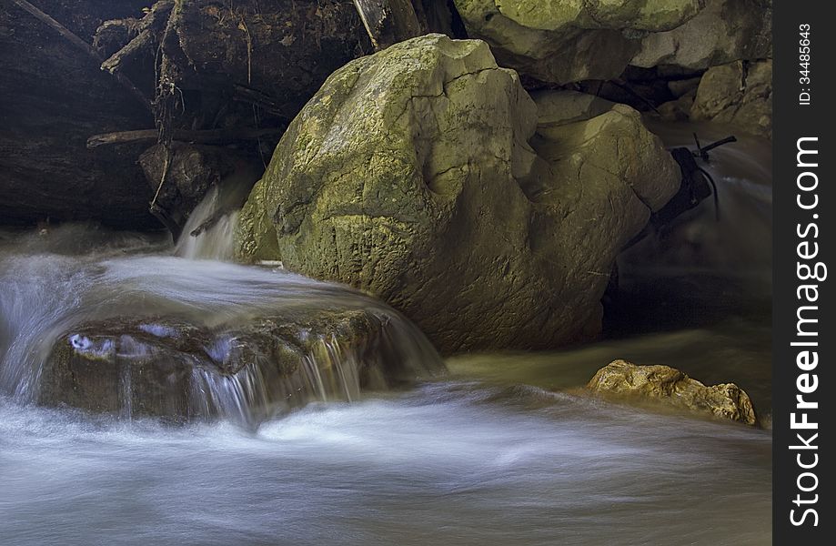 Water on long exposure, falling from a big rock. Water on long exposure, falling from a big rock