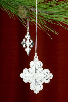 Silver Christmas Ornaments On Burgundy Background Royalty Free Stock Images