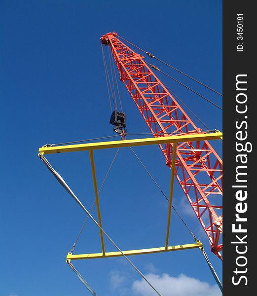 Crane at work taken from a boat yard