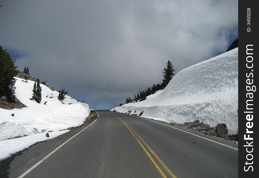 The picture of the main park road running through Crater Lake NP in Oregon. The picture of the main park road running through Crater Lake NP in Oregon.