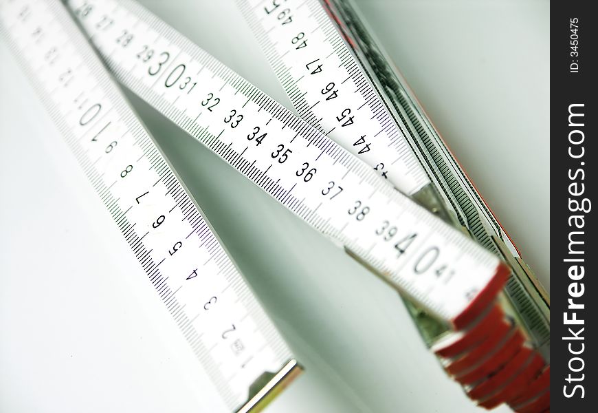 Folding meter on white background.