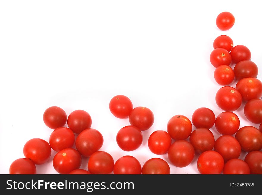 Many red tomatoes on the white background