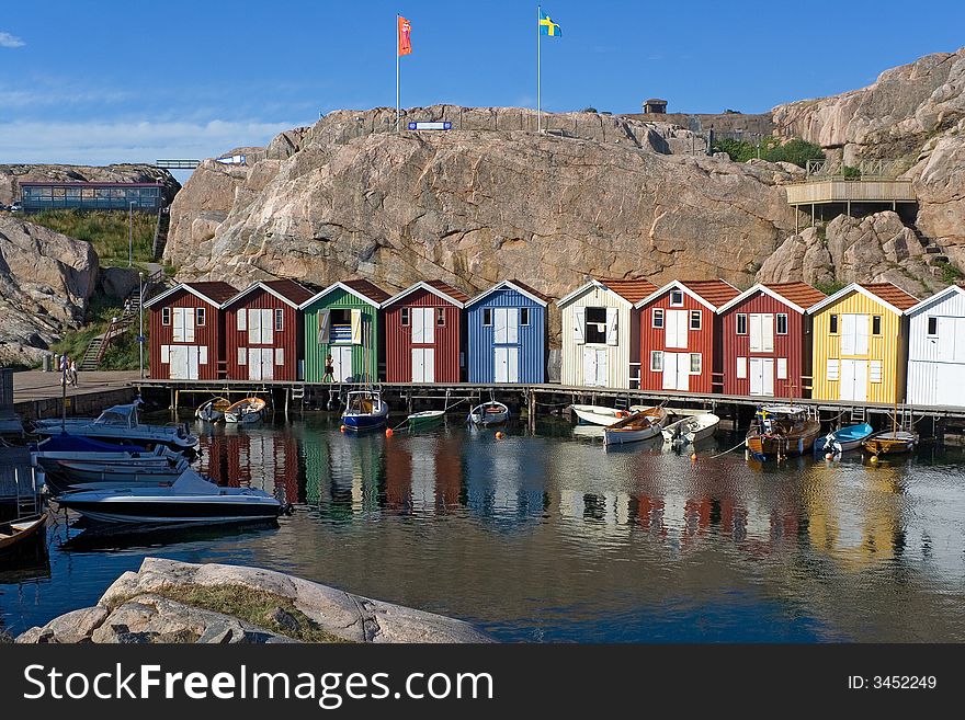 Multy-color boat-houses in small fising village on swedesh west-coast. Multy-color boat-houses in small fising village on swedesh west-coast