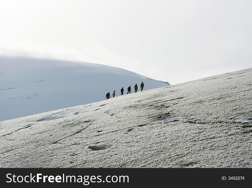 Six explorers in a glacier