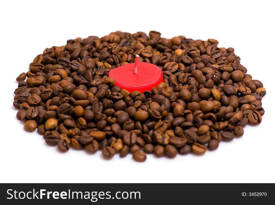 Red candle in coffee beans