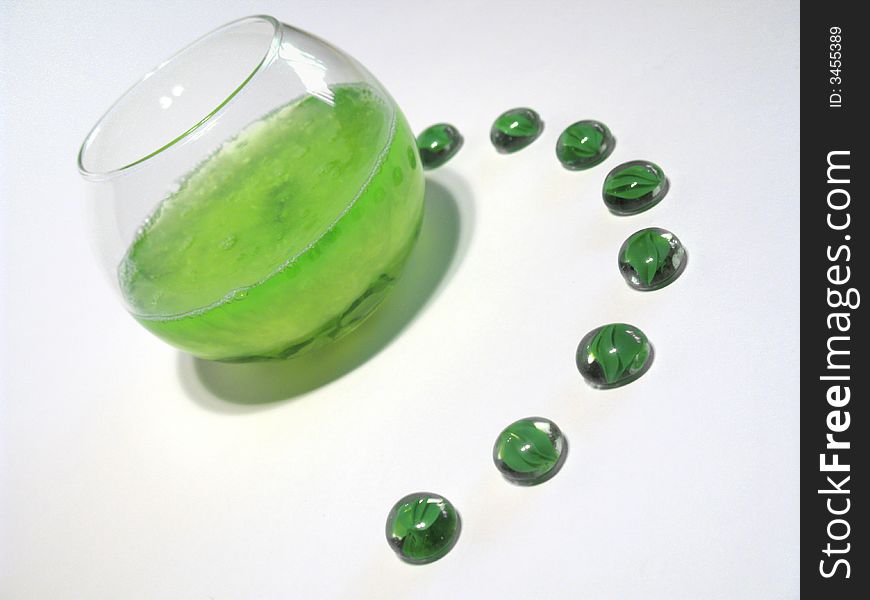 Sphere glass filled with bright green shower gel and green glass pebbles. Sphere glass filled with bright green shower gel and green glass pebbles