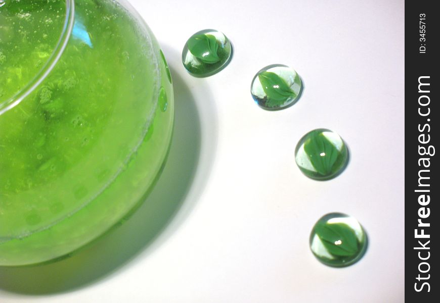 Sphere glass filled with bright green shower gel and green glass pebbles. Sphere glass filled with bright green shower gel and green glass pebbles