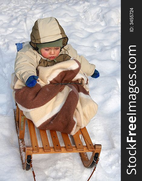 Winter time boy on sled. Winter time boy on sled