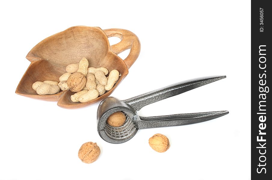 Nutcracker and nuts on the white background