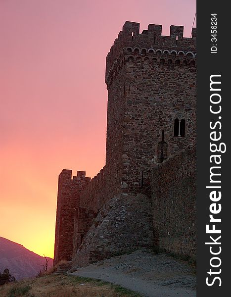 Crimea, tower, fortress, tourism, trip, vocation, travel, ancient, sea, nature, Sudak, Italian, stone, clouds, protection, bastion, shelter, guard, attraction, sightseeing, clouds, sunset, sunrise. Crimea, tower, fortress, tourism, trip, vocation, travel, ancient, sea, nature, Sudak, Italian, stone, clouds, protection, bastion, shelter, guard, attraction, sightseeing, clouds, sunset, sunrise
