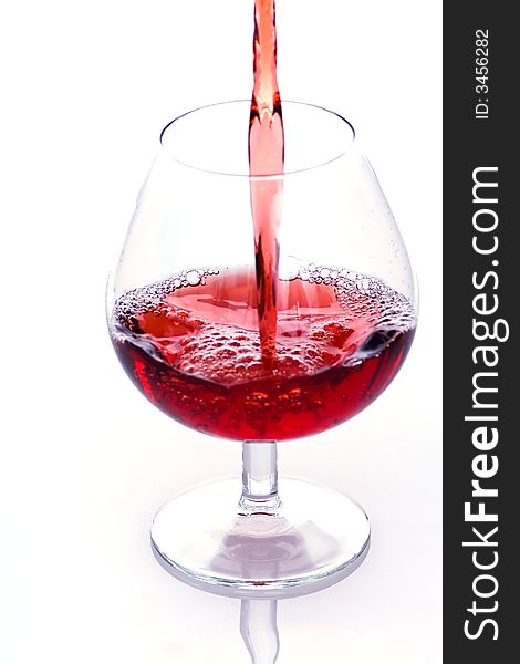 Pouring red wine into the glass - first from series