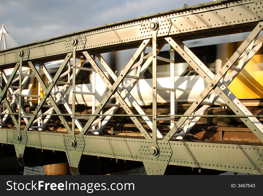 A moving train on a railroad bridge. A moving train on a railroad bridge